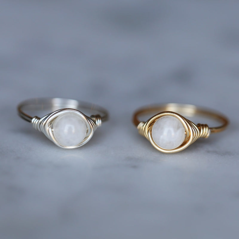 two moonstone gemstone solitaire rings featured side by side 