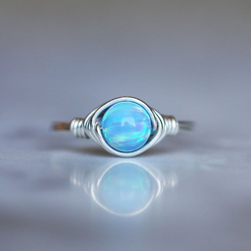 opal gemstone solitaire ring made with blue opal and sterling silver