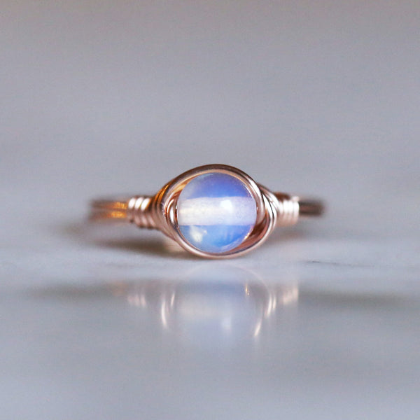 a picture of an opalite solitaire ring made with 14k rose gold filled