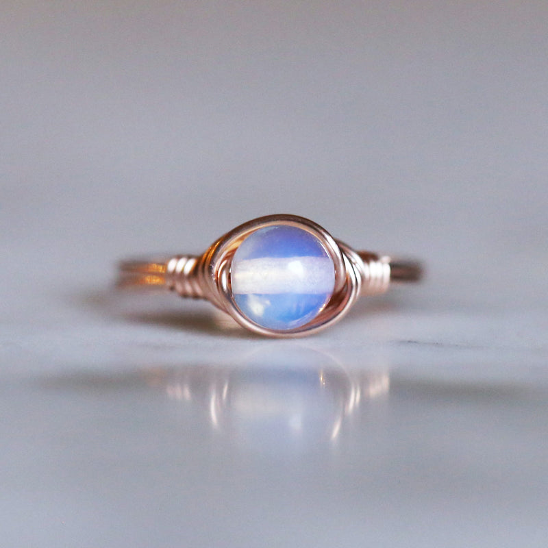 a picture of an opalite solitaire ring made with 14k rose gold filled