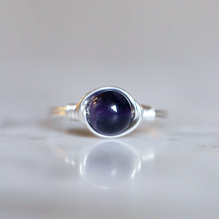 amethyst gemstone ring with a band and setting made of sterling silver