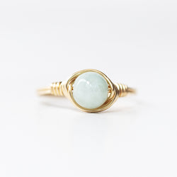 photo of a jade gemstone solitaire ring band and setting made of 14k gold filled